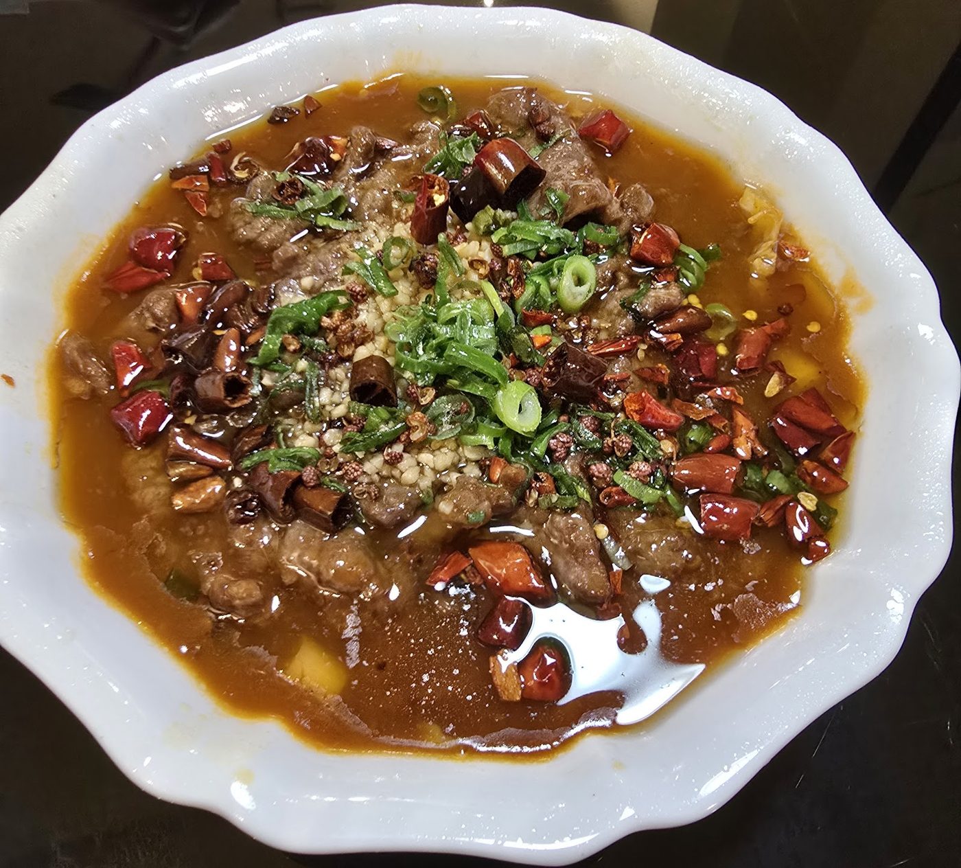 Sliced fish in chilli oil broth
